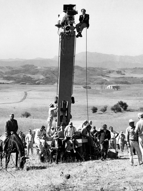 Stanley Kubrick (top, to the right of camera) / on location in Spain during production of Spartacus 