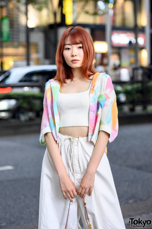 19-year-old Japanese model Uta on the street in Harajuku with an orange hairstyle, a cardigan over a