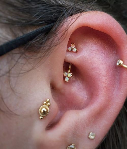 Delicate yet powerful, something I know that I strive to be. Fresh rook piercing with a 14k yellow g