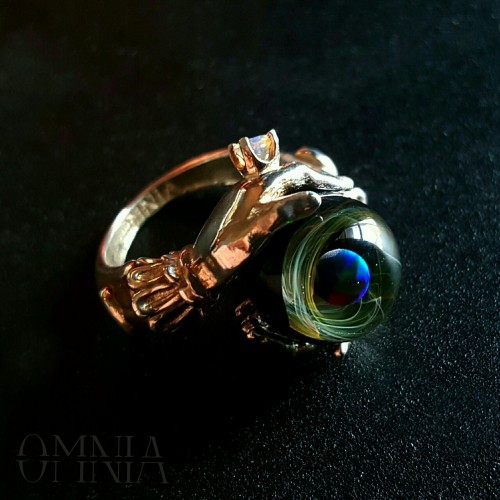 Oracle ring in polished sterling silver, set with a beautiful handmade glass orb containing a black 