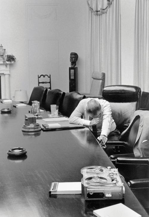 U.S. President Lyndon Johnson listens to a tape sent by Captain Charles Robb (his son-in-law) from V