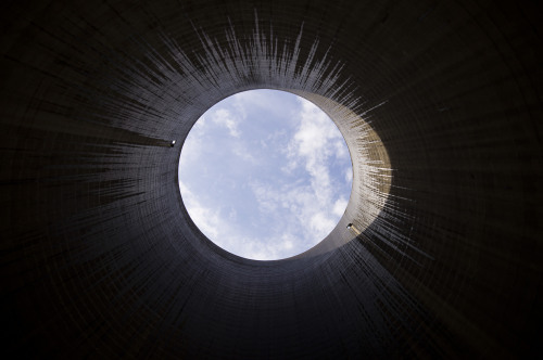 destroyed-and-abandoned:  Looking up from inside a power station cooling tower  That’s cool.