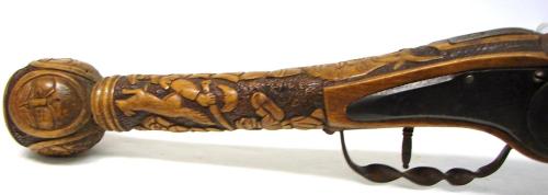 A Germanic styled wheel-lock axe pistol.  The lock itself is from the 17th century but the rest is m