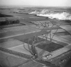 furtho:  Aerial photograph of US tanks moving across fields towards burning houses and the Rhine, Germany, 1945 (via alchetron) 