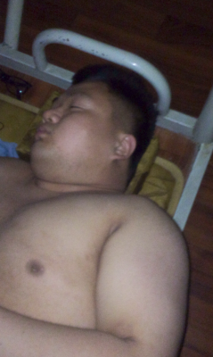 ataraxia0000:  fat guy alseep with small