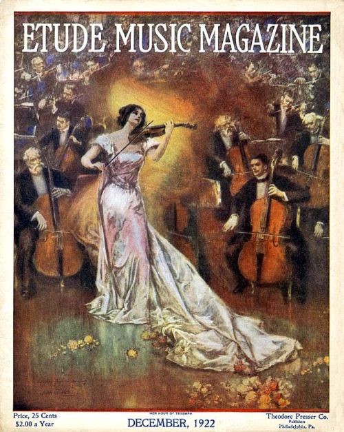Etude Music Magazine, December 1922.Woman in flowing gown plays violin with a symphony orchestra, an