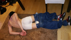 scallyskaterprisoners:  another scally lad, hands and legs cuffed up to prevent escape… during the stuggle to get him cuffed up his jeans fell down and cos he was spitting, they put a hood over his head… he will soon be lead away for punishment 