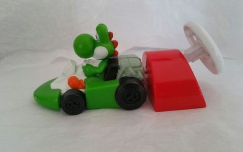 Yoshi stuff!Backpack ($19.79) - Action figure ($4.99) - Keychain ($7.04)Nanoblocks ($3.19) - Pillow 