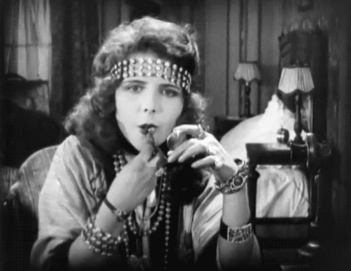 nitratediva:Olive Thomas applies her lipstick in The Flapper (1920).