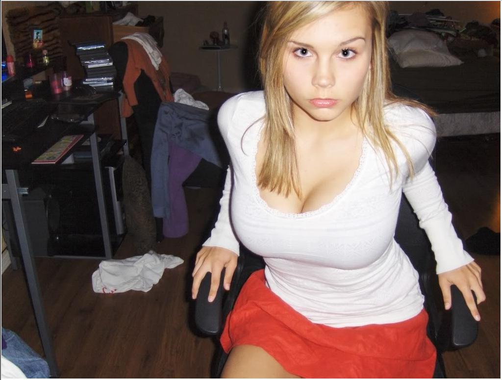 busty-slim-girls:  This cute blonde looks kinda pissed but she’s still hot. And