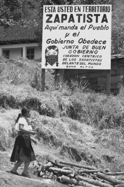 Indigenous Zapatista woman & a sign declaring