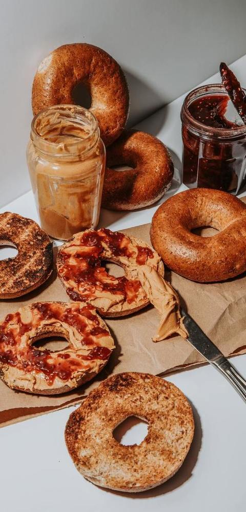 Bagels Recipe - Peanut Butter And Raspberry Jam Spread On Toasted Bagels