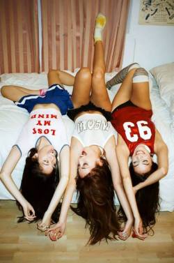 A short skirt, a &ldquo;meow&rdquo; shirt, and thigh-high socks&ndash;three sexy girls who look like they&rsquo;re having lots of fun just hanging out and goofing around.  Really nice pic.