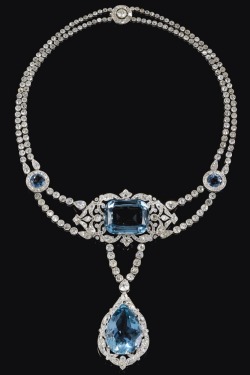 thevintagethimble:  Aquamarine &amp; Diamond Necklace. Cartier. 1912.In the garland style, centring on a cushion-shaped aquamarine within an openwork scroll frame of millegrain-set circular-cut diamonds, suspending a similarly set pear-shaped aquamarine