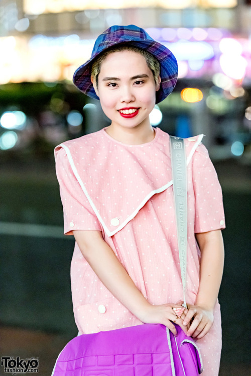 18-year-old Japanese art student Sakurako on the street in Harajuku wearing a vintage polka dot dress, Converse sneakers