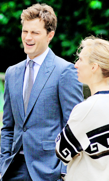 fiftyshadesofgreyinspiration:    Jamie Dornan and Sam Taylor Johnson -  Fifty Shades of Grey reshoots  source:jamie-dornan.org   I love his smile, my smail.
