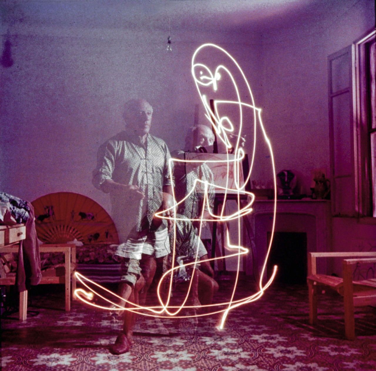 superbestiario:  Triple exposure of artist Pablo Picasso drawing w. light at his