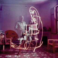 Superbestiario:  Triple Exposure Of Artist Pablo Picasso Drawing W. Light At His