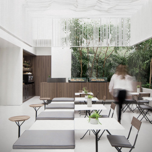 {Love the light and modern feel of the cafe, with a backdrop of plantlife. Designed by Kois Architec