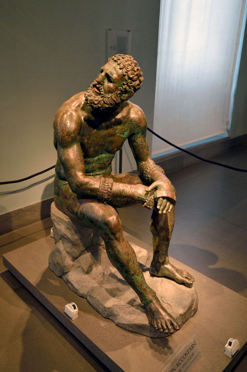 worldhistoryfacts:Greek boxer at rest, 300-200 BCE. Note the scarred face and his leather boxing “gl
