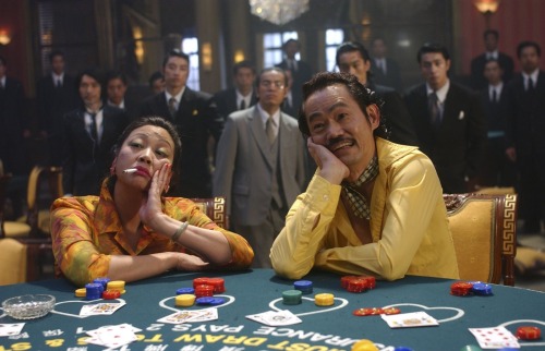 guts-and-uppercuts:  Yup, two seemingly unconnected photos. One being Bruce Lee performing his famous flip-kick in “Enter the Dragon” and the other being the husband and wife landlords from “Kung Fu Hustle”.The connection? That isn’t Bruce