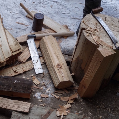 Learning how to make wooden shingles for roof cladding.