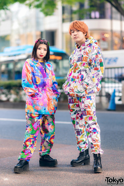 Chinatsu and Taishi - both 18 - on the street in Harajuku wearing colorful graphic fashion by the Ja