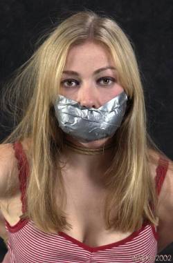 gaggedfts:  Her Mouth is Really Stuffed…Honestly, I Think she Needs More Tape to Hold it all in! :)