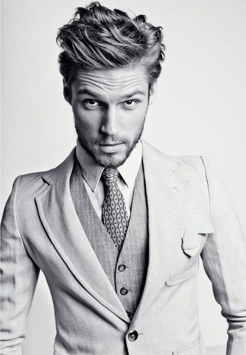 White and Glen Plaid suit with the right hair and a searing stare.