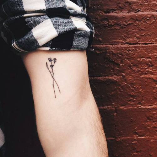 tattoofilter: Minimalist style flower tattoo on James Harness’ inner arm. Tattoo artist: Jon B