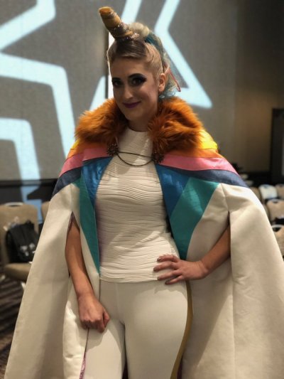 greyisbetterthangray:Finalists Christine Geiger and Olivia Mears wearing their unique She-Ra inspired outfits called “A Horsey of a Different Color” and “She-Ra, The Princess of Power Suits” respectively at the Her Universe Fashion