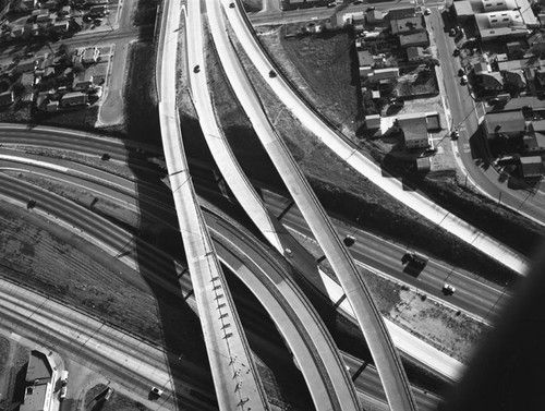nemfrog:  Near Downtown Los Angeles. “Santa Ana Freeway and Long Beach Freeway interchange, looking south.” Howard D. Kelly.  1956. 