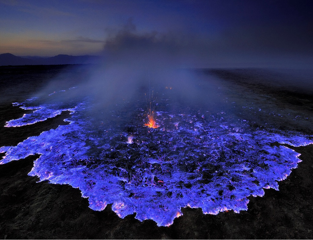 sixpenceee:Neon blue lava pours from Indonesia’s Kawah Ijen Volcano. The reason