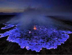 did-you-kno:  Neon blue lava pours from Indonesia’s Kawah Ijen Volcano. The reason it’s blue is because the mountain contains large amounts of pure sulfur, which emits an icy violet colors as it turns. It turns the rocky slopes into a hot, toxic