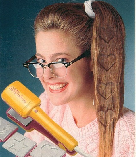 ratchetmess:ratchet shit in the 80’sWait, is that melting shapes into your hair?!