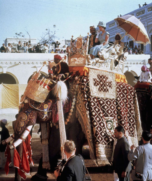 themaninthegreenshirt:Queen Elizabeth rides an elephant  during her tour of India [1961]