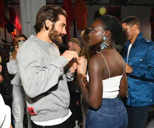 gyllenhaaldaily:Lupita Nyong'o and Jake Gyllenhaal attend the Calvin Klein Collection fashion show d