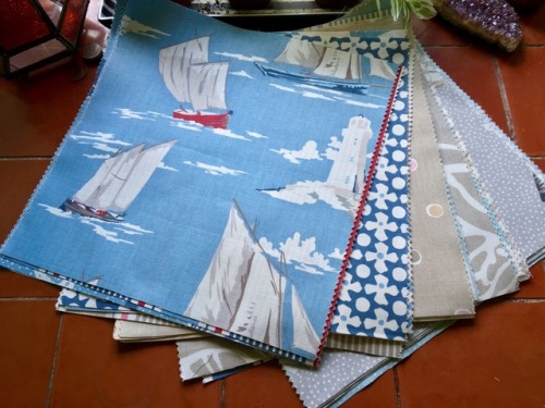 Fabric salvaged from a sample book all cut and ready to be made into a simple patchwork quilt. The f