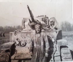 aiiaiiiyo:  My grandfather being an oldschool badass in front of his tank before being wounded in the Battle of the Bulge 1944 Check this blog!