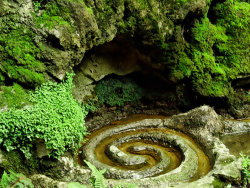 fuckyeahpaganism:  It is one of the greatest mysteries of the Isle of Avalon that two different healing springs, one touched red with iron, the other white with calcite, should rise within a few feet of each other from the caverns beneath Glastonbury