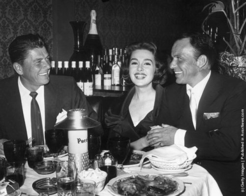 foreverfranksinatra:  Ronald Reagan, Barbara Rush and Frank photographed at Puccini’s Restaurant.