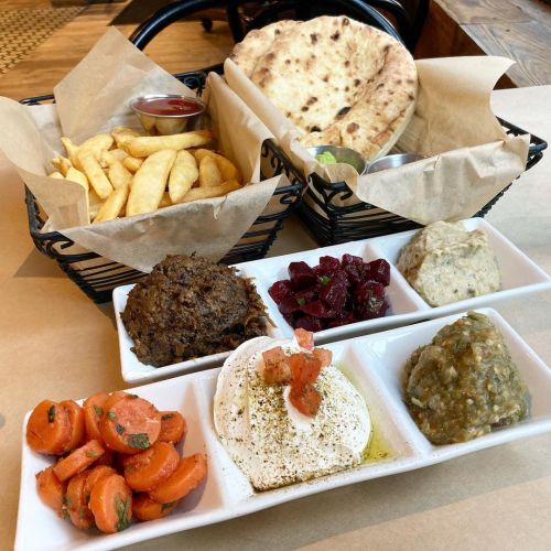 Dips and sides sampler with French fries. San Francisco CA @orenshummus ••• Mmm, went here after 