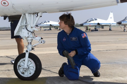 fuckyeahfemaleastronauts: Eileen Collins inspecting her T-38 jet. (x)