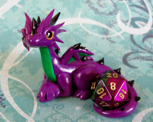 thehappysorceress:archiemcphee:What better creature to protect your precious d20 dice than adorably 