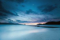 neptunesbounty:  Smooth blue hour under the moon ( National Geographic photo of the day! ) by Dan. D. on Flickr. 