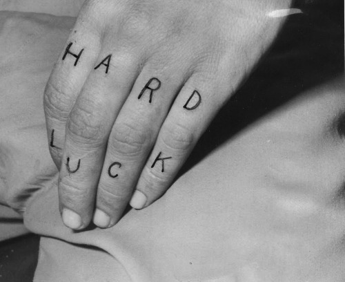 Billy ‘Cockeyed’ Cook tattoo on the fingers of his left hand, 1951