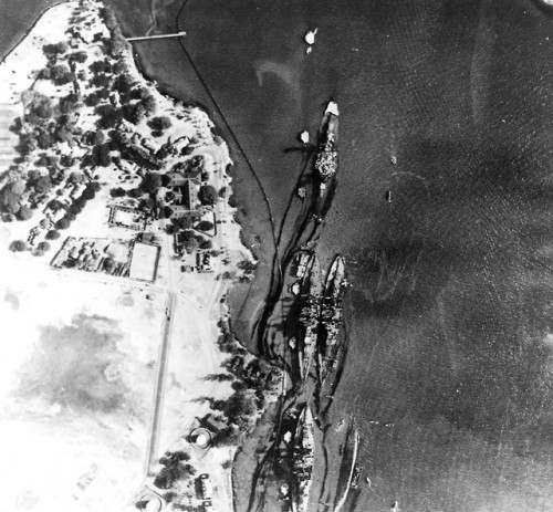 Oil leaks from damaged ships on Battleship Row next to Ford Island(Pearl Harbour, December 7th, 1941