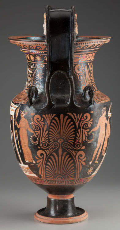 ganymedesrocks:  AN APULIAN RED-FIGURED VOLUTE-KRATER circa 340-320 B.C.. The Krater, attributed to the Group of Copenhagen 4223 obverse with a nude youth and horse within an Ionic naiskos, both in added white, the youth holding a spear and the horse’s