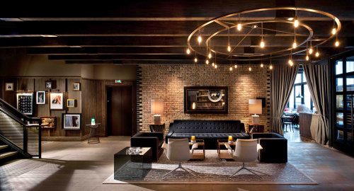 {Feeling the vibe of this hotel by Tara Bernerd. The common areas feel cozy and masculine, with hint