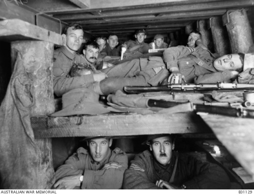 Soldiers at rest in a dugout 15 feet below the Ypres Sector.